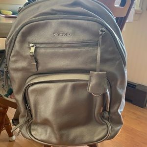 Metallic Tumi backpack